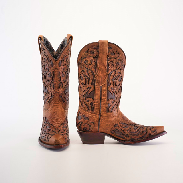 The Trivia Orix - Short Shaft - Snip Toe boots, crafted from premium brown leather, exhibit intricate carved designs on the sides and front. Displayed against a white background, one boot faces forward while the other is angled to highlight its detailed pattern.