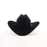 The 1000X Imperial Black hat features a wide brim and a slightly curved crown with a subtle side badge, showcasing classic cowboy charm. Inspired by Larry Mahan designs, it stands out against a pristine white background.