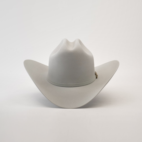 The 500X Superior Platinum cowboy hat is a luxury Western accessory featuring a wide brim and creased crown, crafted from premium belly beaver fur in plain white.