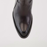 A top-down view of the Francia Rings Tall Shaft Chocolate - J Toe boot, made from premium black leather with a pointed J toe and visible stitching along the sole, set against a plain white background.