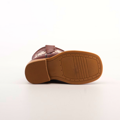 A Jatziry Cogñac - Square Toe boot is showcased sideways on a plain white background, revealing the tan handcrafted leather sole with a textured pattern and brown upper adorned with decorative stitching.