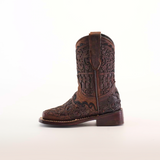 Experience western elegance with the Taurine Matte Chocolate Square Toe cowboy boots, intricately designed with floral and geometric patterns on premium leather. They feature a sturdy heel, pull straps, and are set against a plain white background.