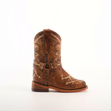 The Graffiti Yellow - Rodeo Toe is a small brown genuine leather cowboy boot featuring intricate white embroidery and decorative stitching, capturing the spirit of young cowgirls. It has a thick heel and a loop for easy wearing, set against a plain white background.