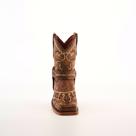 The Graffiti Yellow - Rodeo Toe is a brown cowboy boot made from genuine leather, featuring intricate white stitching and decorative patterns. Ideal for young cowgirls, it offers a stylish pointed toe and mid-height heel for comfort, set against a plain white background.