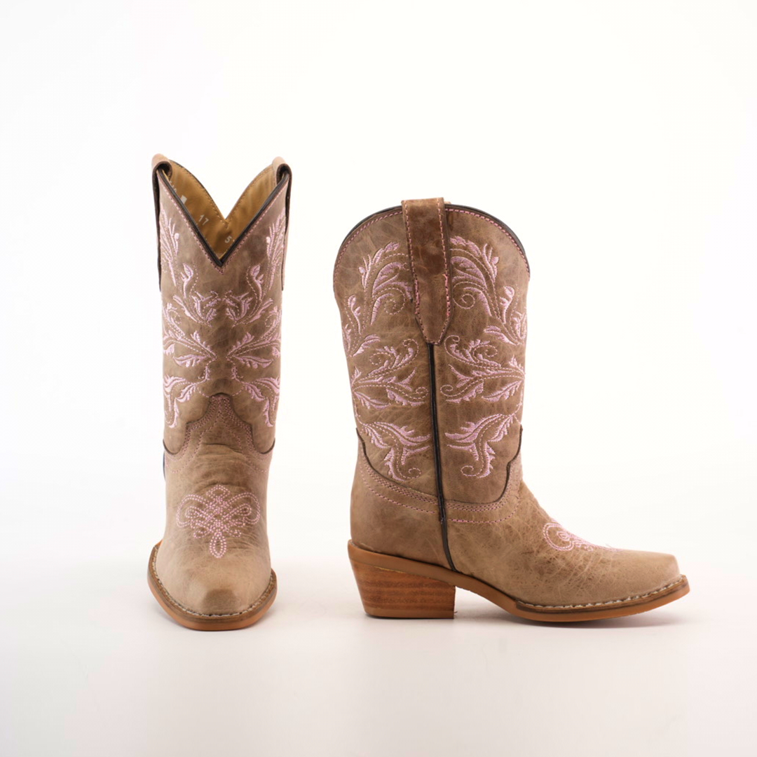 A pair of Bellere Fawn - Snip Toe boots in brown with pink embroidery and mid-height wooden heels crafted from premium cowhide leather. The left boot faces forward, and the right angles to the side, both set against a plain white background.