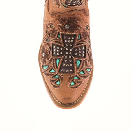 Close-up of the toe of an Alamo Studs Honey - Snip Toe cowboy boot in brown cowhide leather, featuring intricate floral stitching and a large studded cross with turquoise accents. These boots are perfect for anyone seeking standout girls footwear with detailed embellishments.