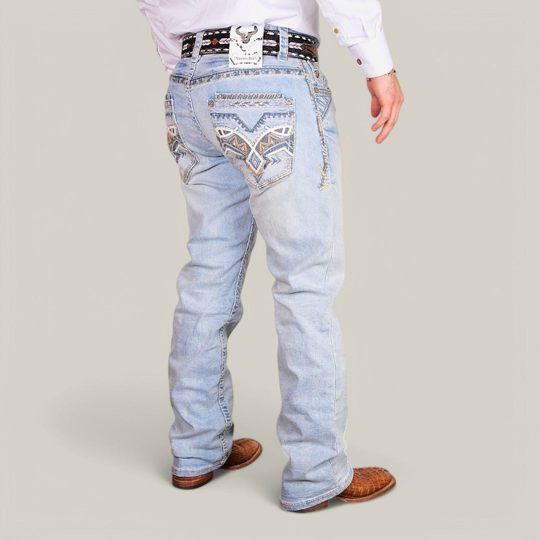 A person wearing Western Blue Straight Fit Embroidered Jeans (WJ2343), detailed with back-pocket designs, a patterned belt with a bull-designed rectangular buckle, a white shirt, and brown cowboy boots.