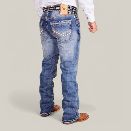 A person is shown from the back wearing Western Blue Straight Fit Embroidered Jeans - W435 with white stitching and a leather waistband label, paired with brown cowboy boots and a white shirt, creating a flattering and effortlessly stylish look.