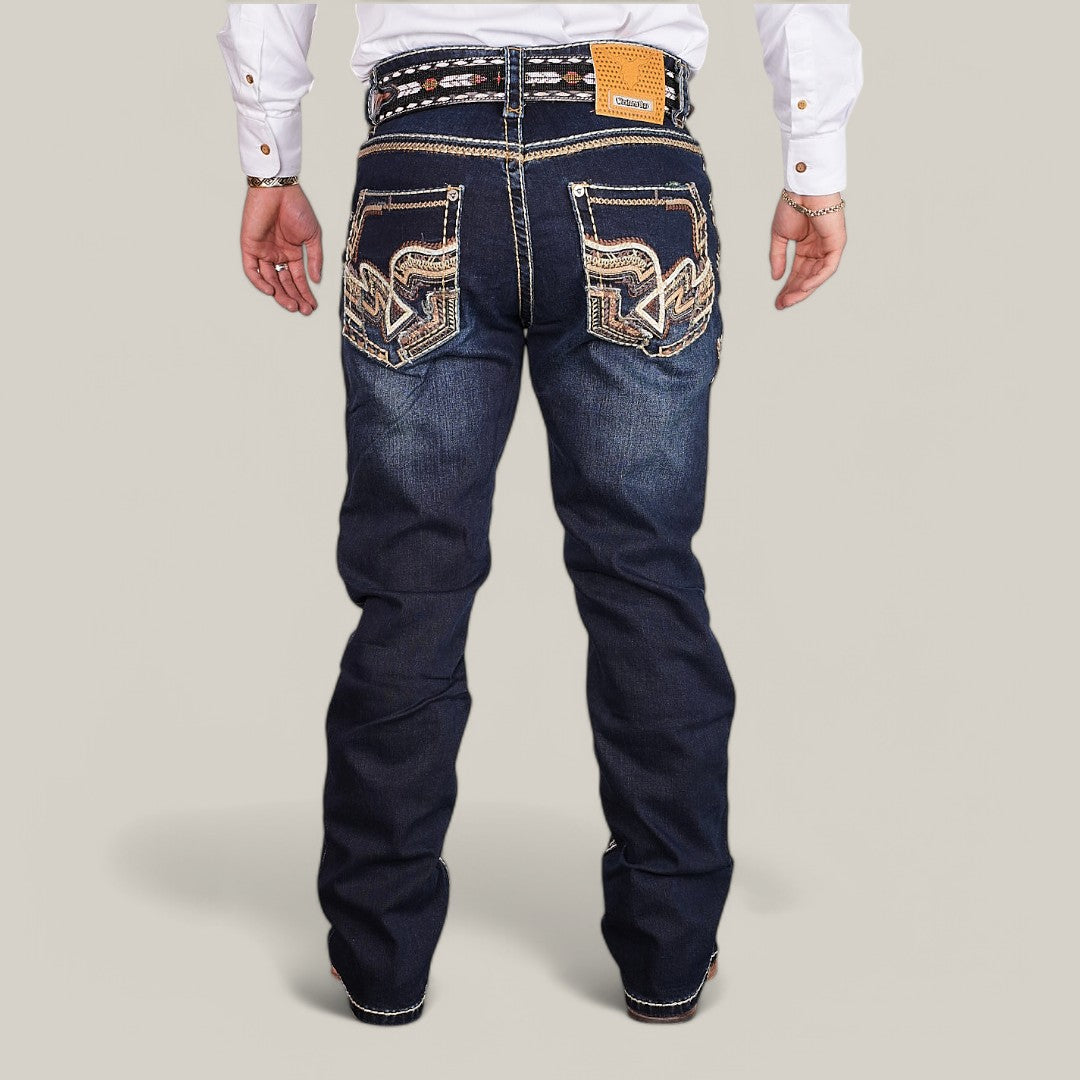 A person wears Western Blue Straight Fit Embroidered Jeans - WM367, showcasing detailed embroidery on the back pockets, paired with a white long-sleeve shirt and a brown belt with a rectangular buckle, while standing against a plain background.