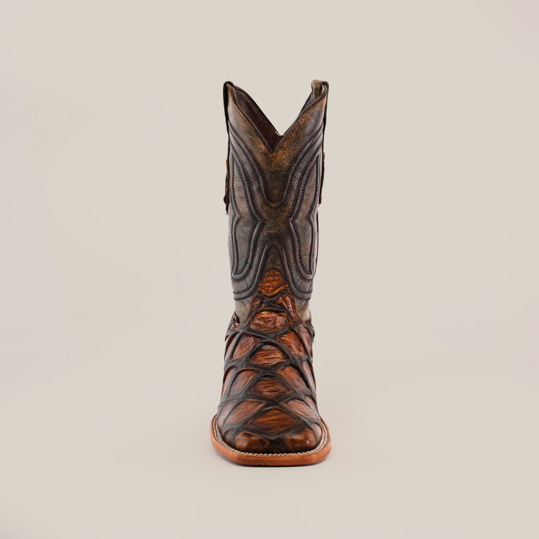 The Pirarucu Print Tan - Square Toe boot, made from premium cowhide with intricate stitching, is centered on a white background, showcasing its square toe and detailed patterns.