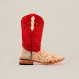 The Cowhide Hair Red Suede Shaft Pinto - Square Toe boot highlights a red suede shaft with intricate stitching, contrasted by a light tan and brown speckled cowhide leather lower section, complemented by a wooden heel against a plain white background.