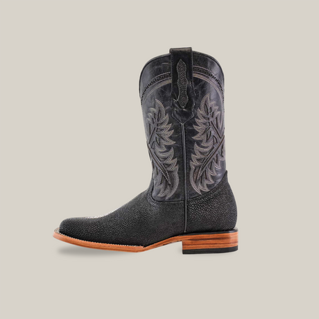 The King Stingray Print Black - Square Toe cowboy boot stands upright on a white background, showcasing intricate stitching, a smooth pointed toe, a mid-height wooden heel, and decorative shaft overlays.