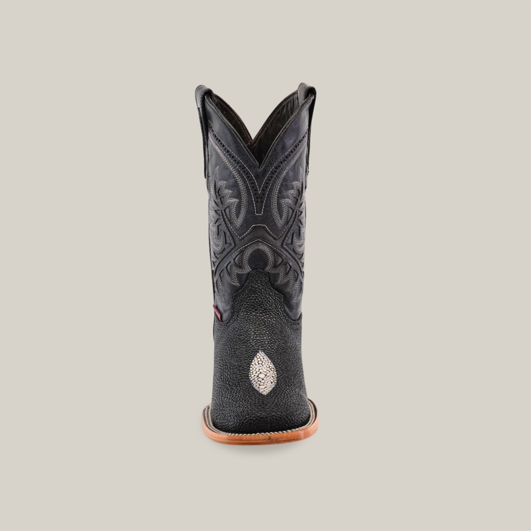 The King Stingray Print Black - Square Toe boot features intricate stitching on premium cowhide leather and a light-colored emblem near the toe, all set against a plain white background.