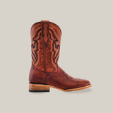 A single Fresno Shedron cowboy boot, made of premium brown cowhide leather with intricate black stitching, is displayed against a white background. It features a wooden sole and square toe, combining style and durability.