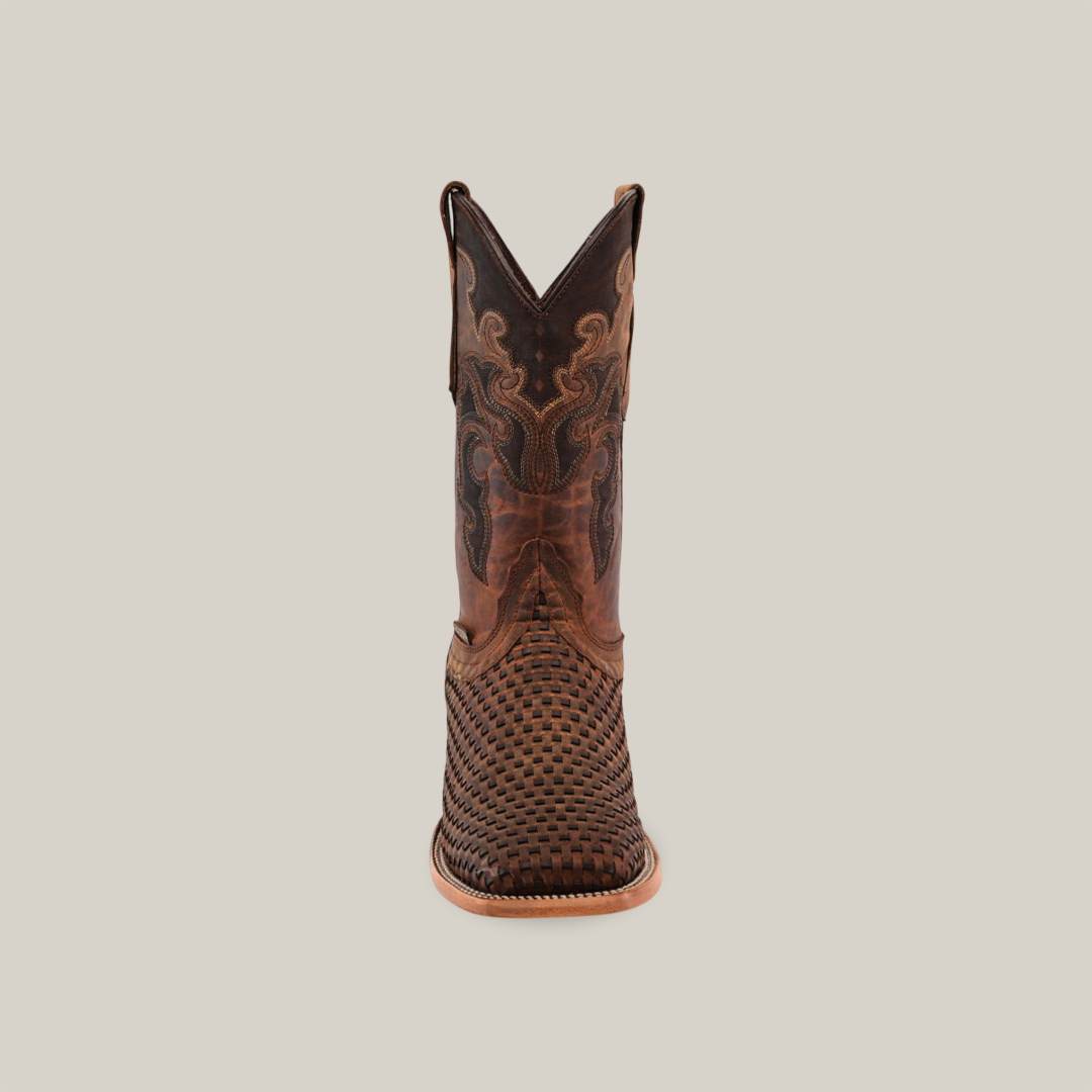 A brown cowboy boot, made of premium cowhide, is set against a white background. It features intricate stitching on the shaft and the Texas Basket Weave Matte Brown pattern on its square toe, with a light brown sole and heel.