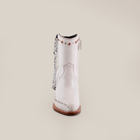 The Milan Chains Bootie Frost White - J Toe from the Platinum Collection is a single white cowboy boot made from premium leather, featuring decorative studs, a silver sequined fringe on the back, intricate stitching, and a wooden sole. It stands elegantly against a plain white background.