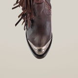 Close-up of the Dallas Fringe Bootie Chocolate J Toe in rich leather, featuring fringe details and an ornate metallic toe cap from the exclusive Platinum Collection. Captured on a white background, this piece exudes timeless western elegance.