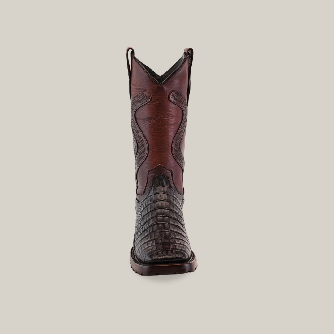 Front view of the Exotic Caiman Belly Tail - Diamond boots in Tabaco, showcasing intricate stitching and a textured design. These tall brown leather cowboy boots feature a durable Goodyear welt double sole square toe, set against a plain background for classic cowboy style.