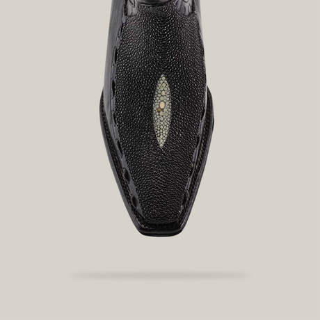 Close-up of the Exotic Stingray - Platinum - Black - Versy Toe shoe from the Platinum Collection, showcasing its unique stingray leather texture with a central circular design. The pointed toe and detailed stitching create an elegant look against a plain white background.