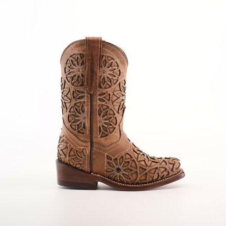 The Vitralli Studs Fawn Snip Toe cowboy boot features intricate floral cut-outs, a snip toe design, and premium leather. It has brown stitching, a low wooden heel, and stands elegantly against a white background.