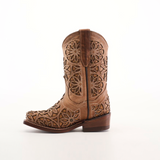 The Vitralli Studs Fawn Snip Toe is a brown cowboy boot featuring intricate cutout floral patterns and decorative stitching. Crafted from premium leather with a classic western heel and medium brown sole, it blends traditional craftsmanship with a modern aesthetic.