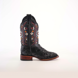 A single Exotic American Alligator Patchwork Black Square Toe cowboy boot features intricate red, white, and brown stitching. Its square toe design harmonizes with a low wooden heel and embossed texture, elegantly displayed on a plain white background.