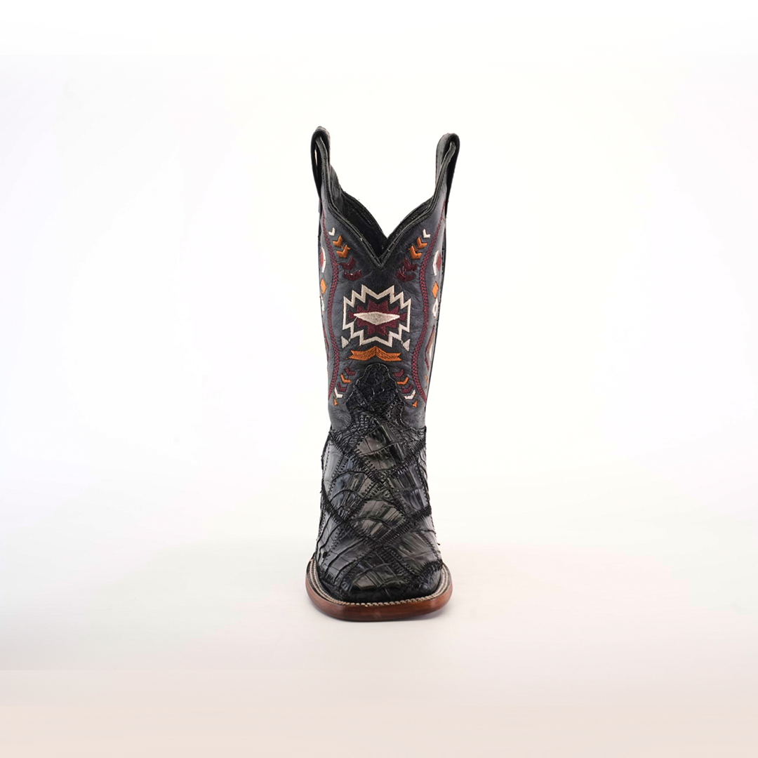 The Exotic American Alligator Patchwork Black Square Toe boot showcases a variety of textures and multicolored geometric patterns on exotic leather, with a slightly pointed toe and sturdy wooden sole, set against a plain white background.