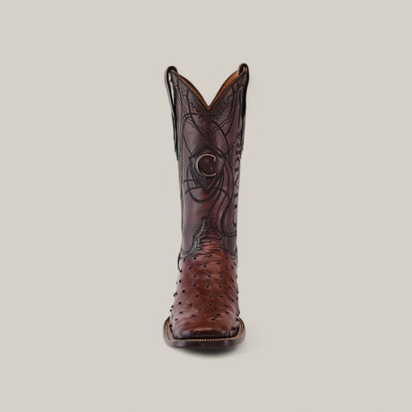 A single CU677 boot from Flame Brown Ostrich collection showcases intricate laser and embroidery on ostrich leather with a square toe, viewed from the front against a plain background.