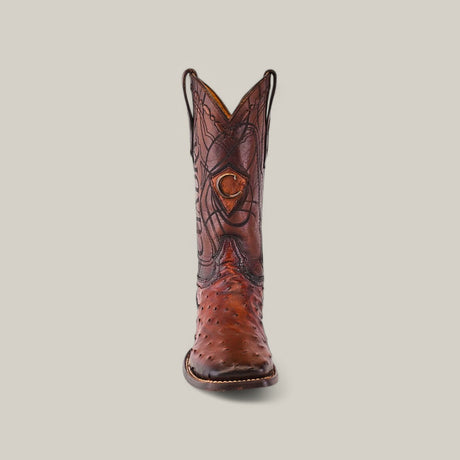 A Moroni Chestnut Ostrich Laser & Embroidery cowboy boot (CU457) with intricate patterns and decorative embroidery in brown leather, features a square toe and is upright against a plain light gray background.