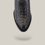 Close-up of the Plunge Black Caiman Laser & Embroidery shoe (CU422), featuring a crocodile pattern and round toe, against a light beige background.