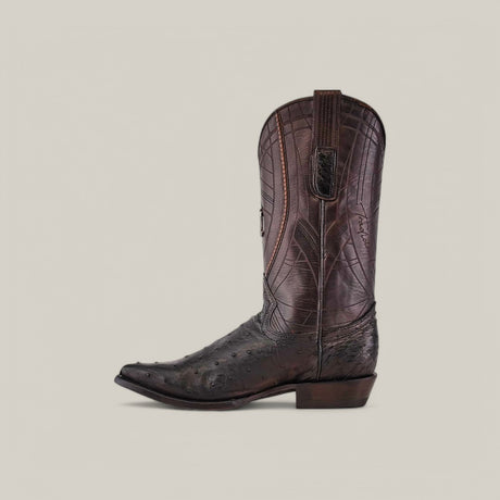 The CU807 features a snip toe and pointed tip with detailed embroidery on a brown cowboy boot. The textured surface, resembling Black Ostrich Laser, is paired with a mid-height heel. This fashionable Cuadra Boots piece stands against a plain light gray background.