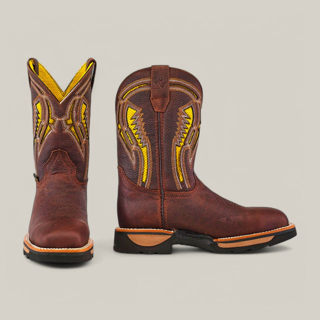 The Floter Brown Soft Toe - E6187 boots feature intricate yellow stitching on brown leather, rugged texture, waterproof design, and durable soles, shown with one boot forward and the other in profile against a neutral background.