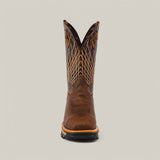 Front view of the Amazonas Tanger Composite Toe - E6257 features a brown cowboy boot with intricate shaft stitching, reflecting rugged durability. Its round toe and sturdy sole stand against a plain, light gray background.