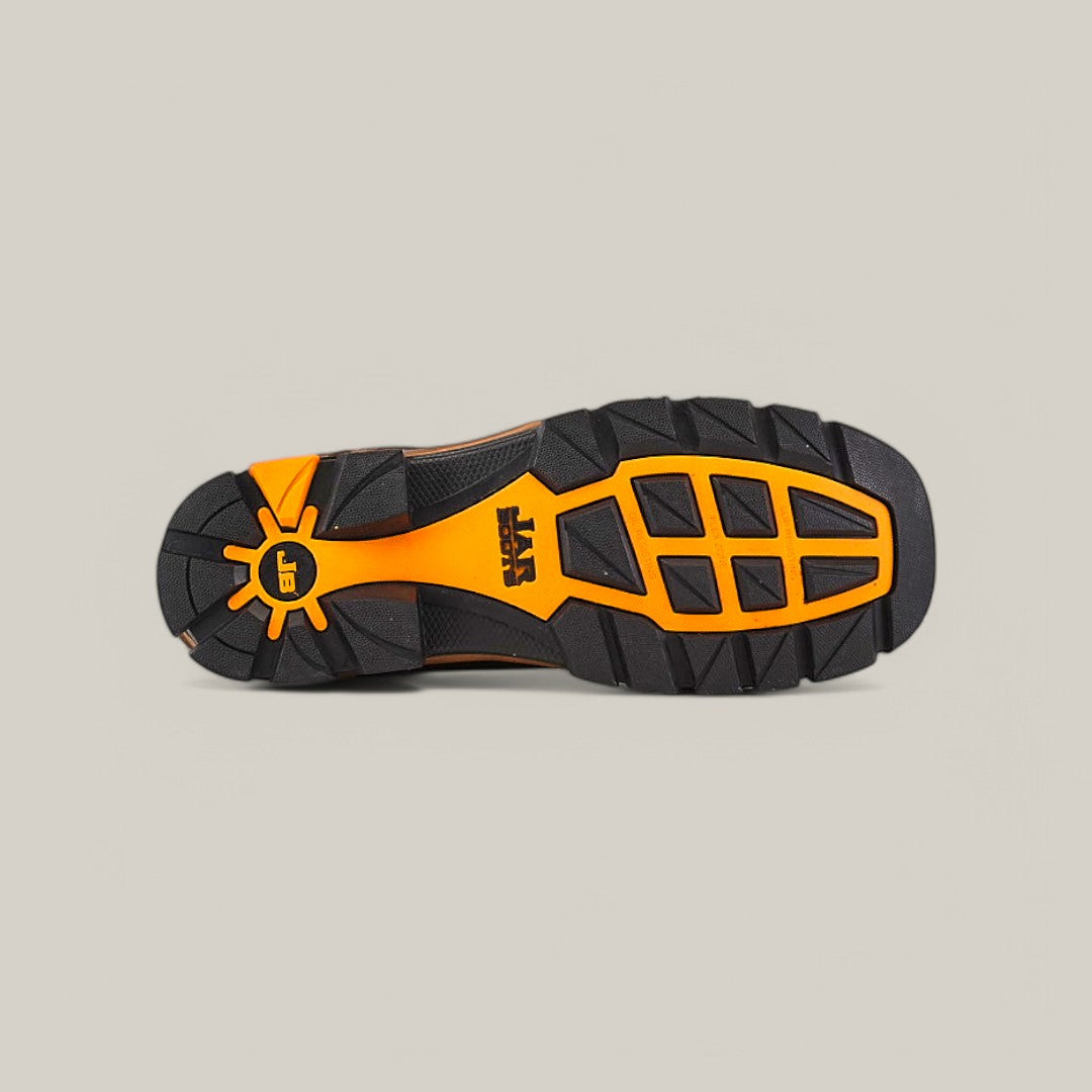 The image features the sole of the Amazonas Tanger Soft Toe - E6257, a durable shoe designed for Texas Country Work Boots. It has a black and orange color scheme, deep tread patterns for grip, a logo at its center, and is set against a plain grey background to highlight its resilient construction.