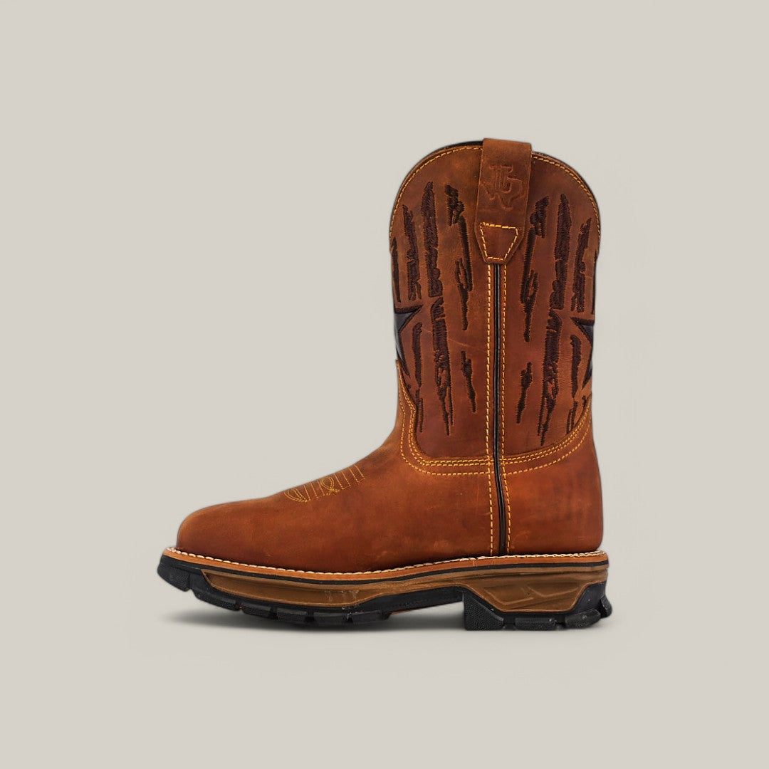 Side view of the Amazonas Honey Soft Toe - E6259, crafted from brown leather with decorative stitching and a pull tab. This durable boot features a black rubber sole and stacked heel, ideal for withstanding the elements against a plain gray background.