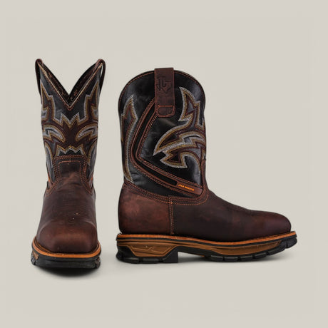 The Amazonas Chocolate Composite Toe - E6002 boots display intricate shaft stitching. One boot stands upright to highlight the design, while the other shows a side profile. Built for durability, these boots feature sturdy soles ideal for rugged adventures.