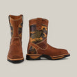 A pair of durable Crazy Brown Military Soft Toe boots, E6017, with camo side panels. One boot stands upright; the other is slightly angled to show the heel. They feature sturdy soles and a front flap logo, perfect for rugged adventures.