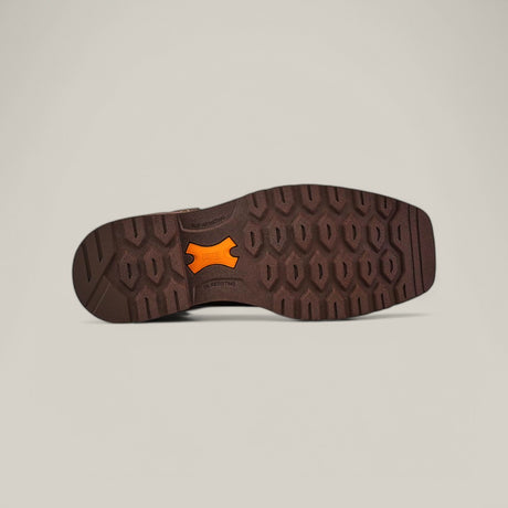 The image shows the sole of the Activator H2o Drk Brown work boot (Soft Toe - 10060892) with a textured, hexagonal pattern. Two orange elements labeled VIBRAM and FLEX are embedded in the design, highlighting its waterproof technology against a light gray background.