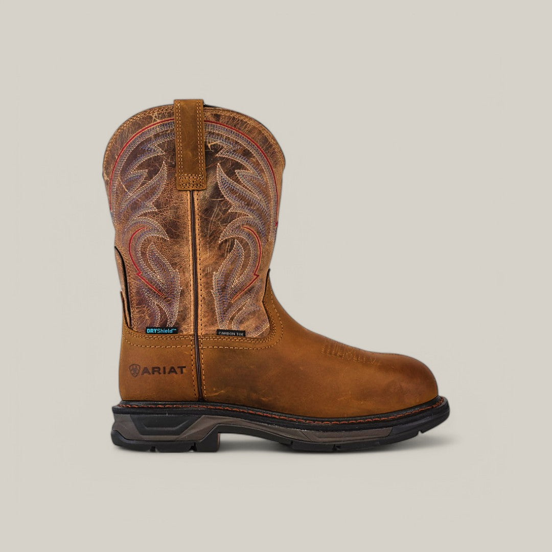 The Workhog Xt H2O Brown - Composite Toe (10045435) features intricate stitching on a waterproof leather shaft with a pull tab, a sturdy black sole with Ariat branding near the heel, and a comfortable round toe design.