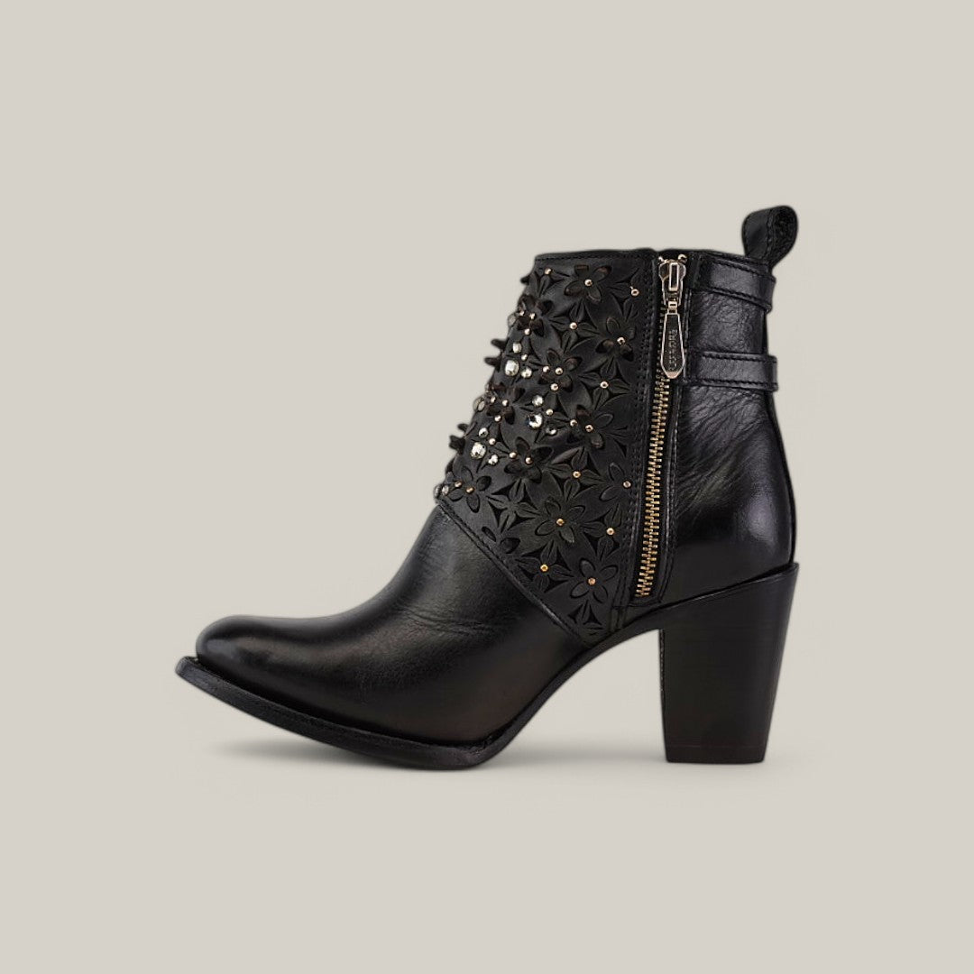 The Black Laser & Crystals - Round Toe - CU439 is a black leather ankle boot with a chunky heel, side zipper, and floral embellishments accented by sparkling crystals from Cuadra, featuring a sleek design and round toe.