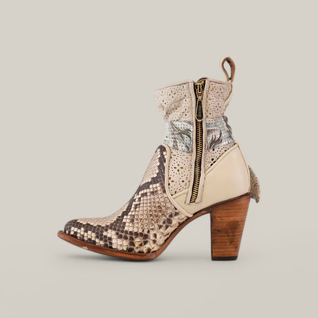 The Plunge Natural Python Zipper & Cut Out - Round Toe - CU570 is a stylish boot with a python design, featuring a thick wooden heel, zipper closure, and intricate detailing in beige, brown, and cream colors. It also includes a convenient pull tab at the back.