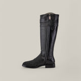 The Black Stingray Zipper - Round Toe - FC637 is an elegant riding boot crafted from black leather with a side zipper. The lower section features textured stingray leather, while the upper remains smooth, all set against a light gray backdrop.