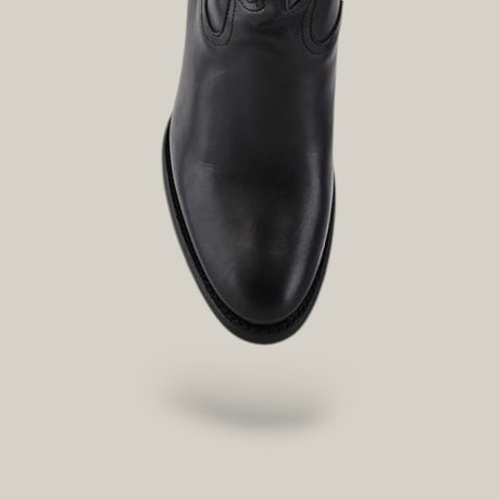 The Black Embroidery - Round Toe - CU874 shoe is depicted facing downward, showcasing its polished surface and fine stitching. It features a black leather boot design with a round toe, set against a plain light gray background.