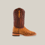 The Exotic Caiman Horn Back - Brown - Square Toe is a single cowboy-style boot with a genuine leather light brown textured lower and darker brown shaft. It features intricate stitching, a pull strap, and a light brown sole with a low heel against a plain beige background.