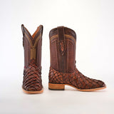 A pair of Exotic Piraruco Fish - Matte Brown - Square Toe cowboy boots, featuring a textured scaly lower reminiscent of Piraruco boots and smooth leather uppers, is showcased against a plain white background.