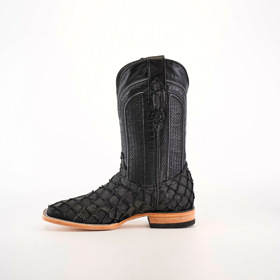 A single Exotic Piraruco Fish boot, matte black with a light brown sole, is shown against a white background. The square toe boot features intricate stitching and a side view highlighting its tall shaft.