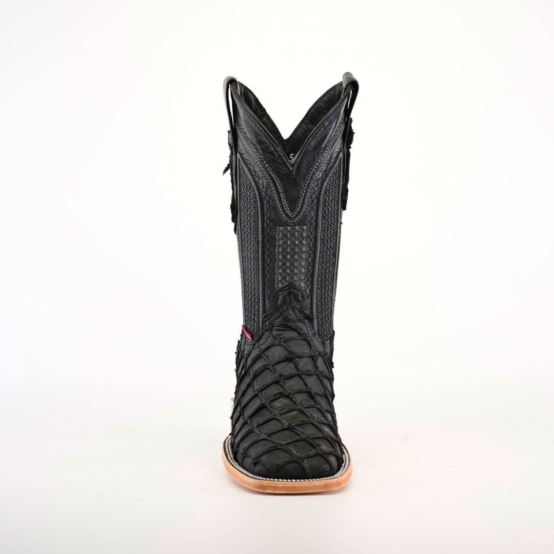 Front view of a single Exotic Piraruco Fish - Matte Black - Square Toe cowboy boot in genuine leather with textured shaft and Piraruco fish scales on the foot, tan sole, and square toe, against a plain white background.