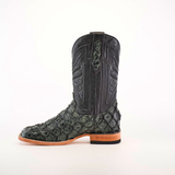 The Exotic Piraruco Fish - Charcoal is a single cowboy boot featuring a dark green and black reptile pattern from Piraruco fish leather on the foot and a smooth black leather shaft with intricate stitching. It has a wooden heel, light-colored sole, and distinct square toe design for fashion enthusiasts.