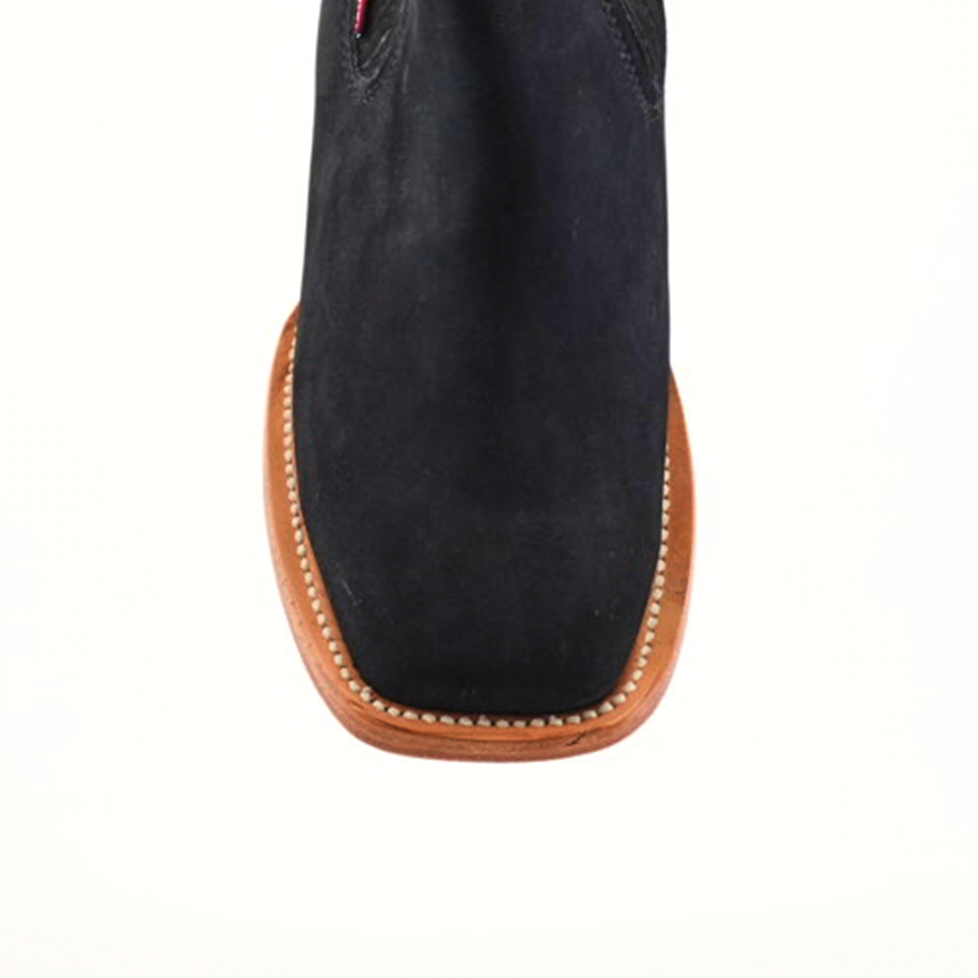 Top view of the Prime Suede Black Square Toe boot, showcasing a black suede upper, brown leather sole with edge stitching, set on a plain white background. This design embodies a sleek, modern cowboy fashion style with its understated elegance.