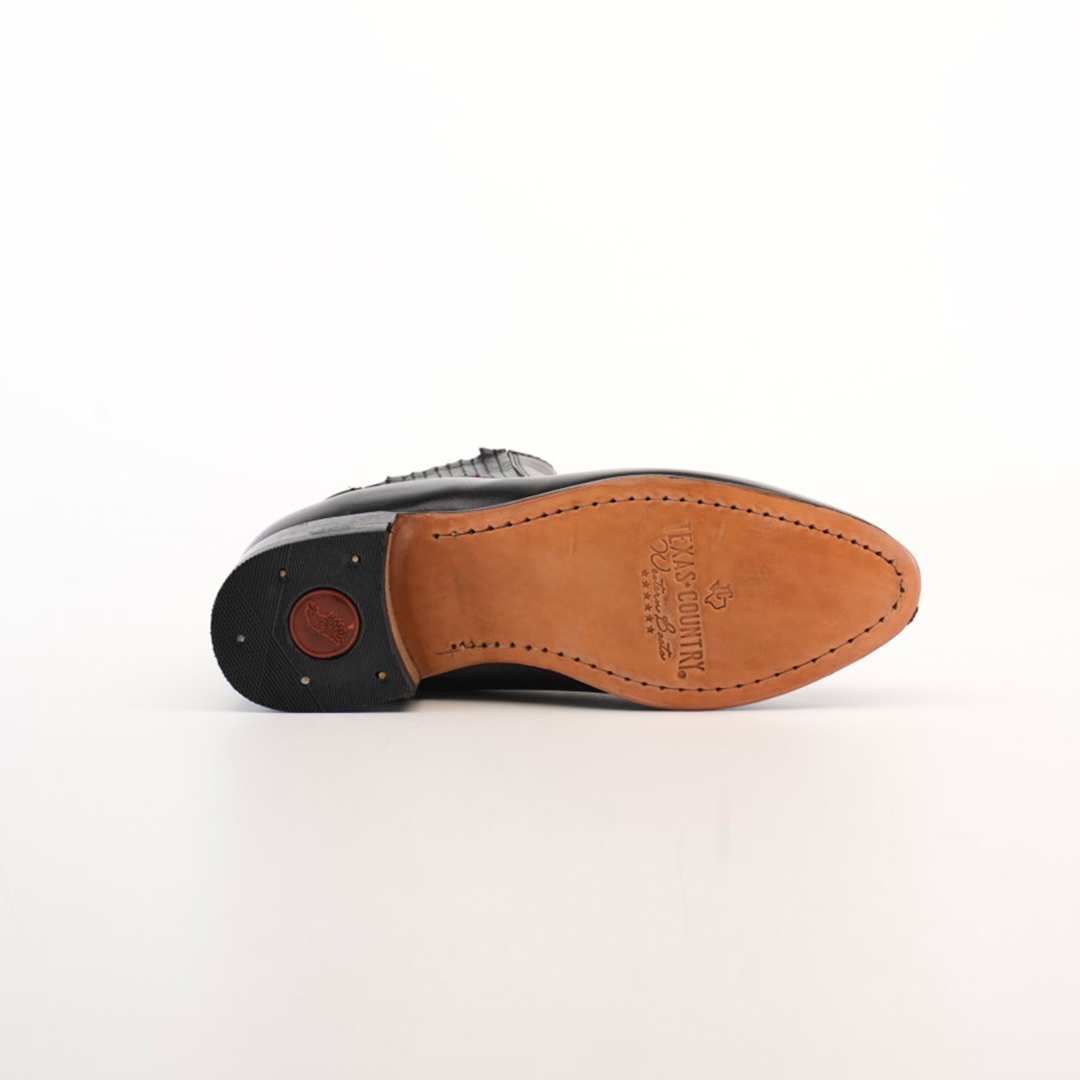 The bottom view of the Napa Black Square Toe shoe reveals its tan sole, detailed stitching, and a rubber nonslip heel featuring a small circular logo. The embossed sole shows brand and size markings. Ideal for fashion-forward wardrobes, its set against a plain white background.